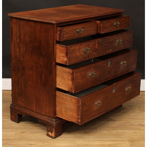 102 - A George III oak chest, slightly oversailing top above two short and three long graduated cockbeaded... 