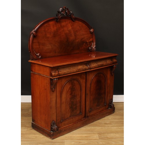 114 - A Victorian mahogany chiffonier, arched back crested by a carved fruiting pear branch, the projectin... 