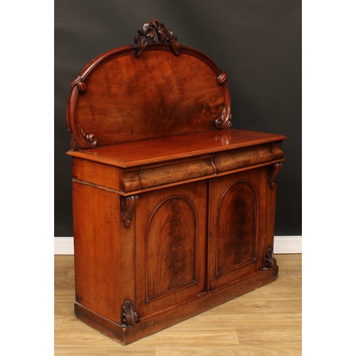 114 - A Victorian mahogany chiffonier, arched back crested by a carved fruiting pear branch, the projectin... 