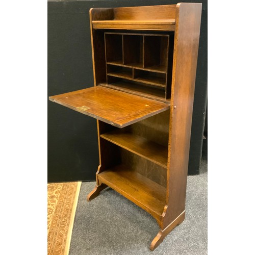 12 - A narrow oak students bureau, shelf top above fall front writing surface, the  interior with pigeon ... 