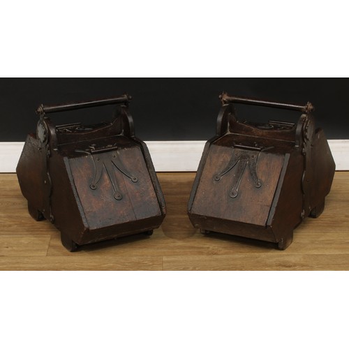 66 - A pair of Neo-Gothic iron-bound oak fuel bins or purdoniums, 44.5cm high, 33.5cm wide, 59.5cm deep