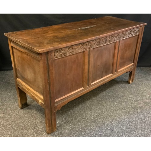 77 - An 18th century oak blanket box, c.1760

planked top, three panelled  front, the frieze carved with ... 