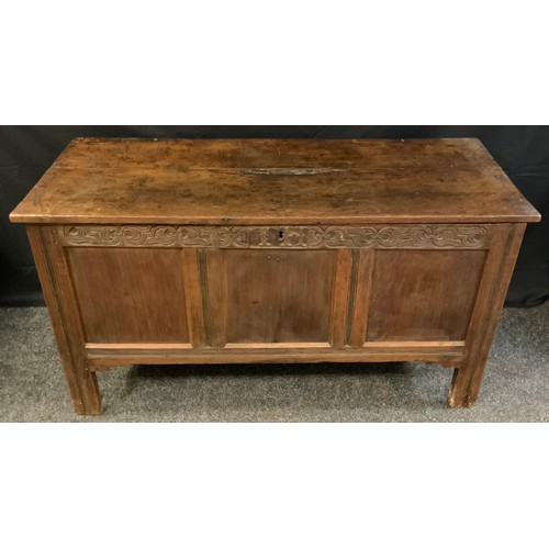 77 - An 18th century oak blanket box, c.1760

planked top, three panelled  front, the frieze carved with ... 