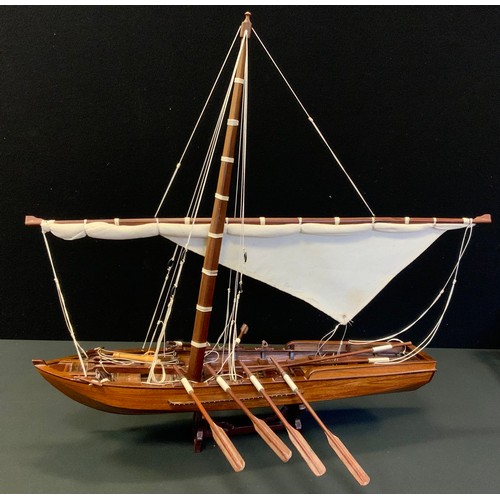 81 - A model boat, single mast, fore point slide cannon, eight oars & Loops, 64,5cm high, 61cm long