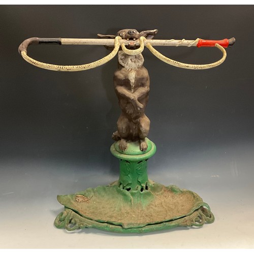 87 - A 19th century Coalbrookdale novelty cast iron stick stand, in the form of a dog on its hind legs ho... 