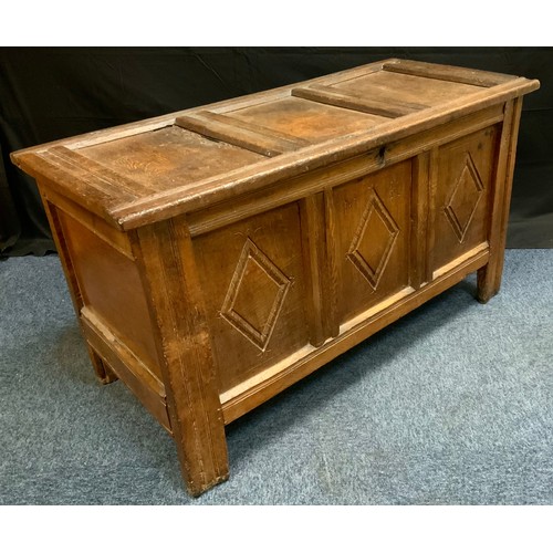 90 - An 18th century oak blanket box, c.1740

three panelled top and front, carved with lunettes, initial... 