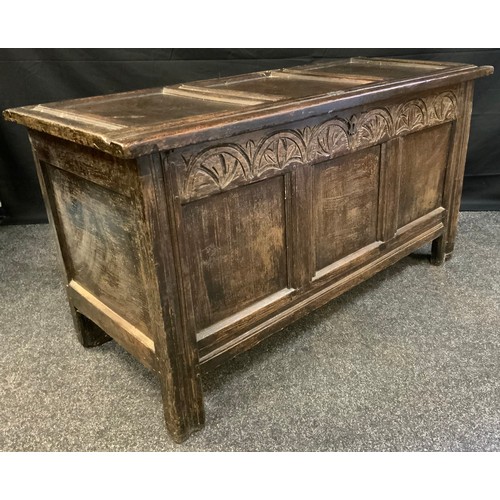 96 - An 18th century oak blanket box, c.1760

three panelled top and front, carved lunette frieze, stile ... 