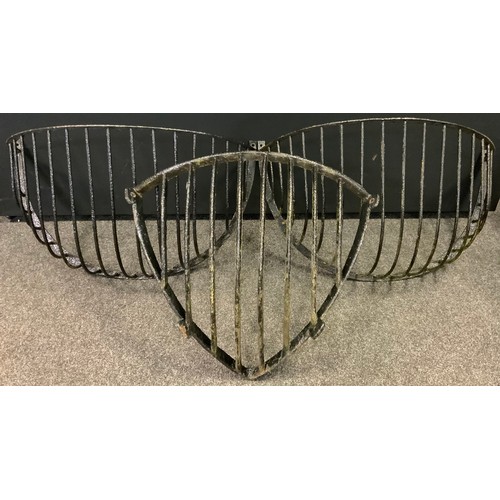 101 - A pair of late 19th / early 20th century cast iron hay-rack cattle feeders, each 101cm wide;  anothe... 