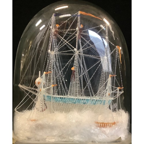 161 - A 19th century Lampwork Glass Maritime   model of a ship, with three masts, under a dome, 34cm high,... 