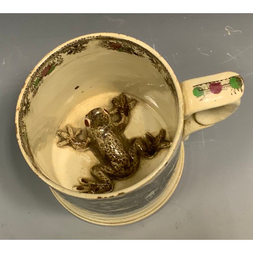 170 - A Victorian Staffordshire Frog mug, transfer printed with a girl in a swing, printed in black, picke... 