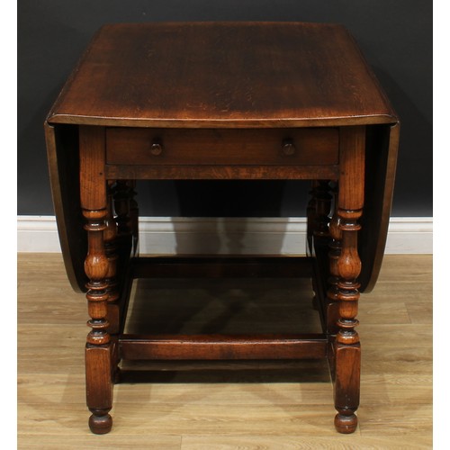 275 - An 18th century style oak gateleg dining table, by Titchmarsh & Goodwin, oval top with fall leaves, ... 