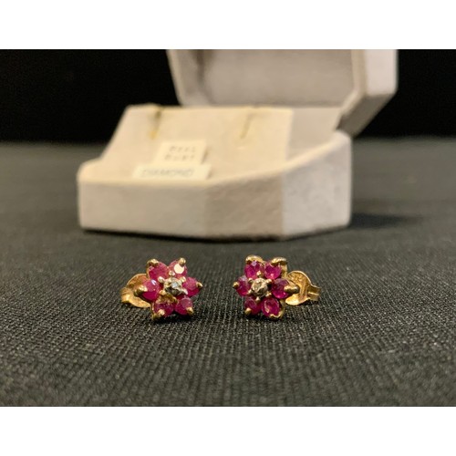 703 - A pair of ruby and diamond floral cluster earrings, 9ct gold mount, 1.2g gross