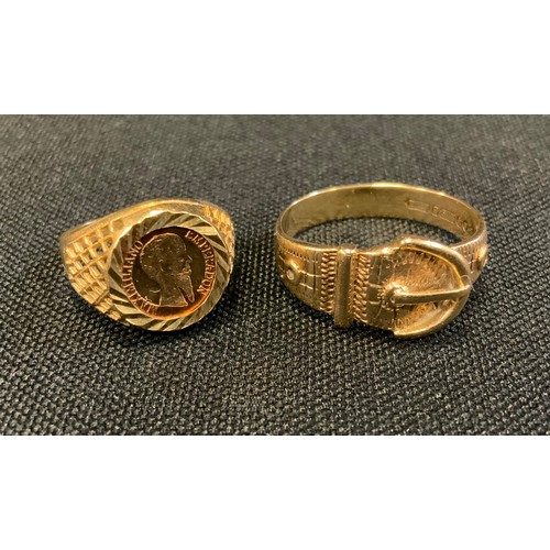 709 - A 9ct gold buckle ring, size U, 4.4g;  a 9ct gold Mexican coin signet ring, Maximiliano Emperadon, s... 