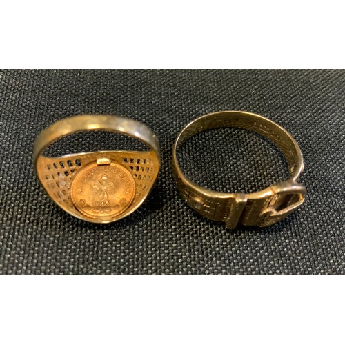 709 - A 9ct gold buckle ring, size U, 4.4g;  a 9ct gold Mexican coin signet ring, Maximiliano Emperadon, s... 