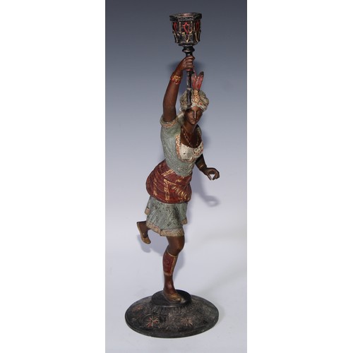 121 - A pair of cold painted blackamoor candlesticks, cast in the Orientalist taste as turbaned figures, 4... 