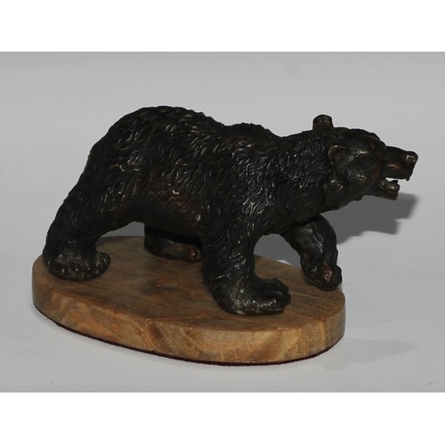 122 - Continental School, a dark patinated bronze, of a bear, oval base, 19cm long