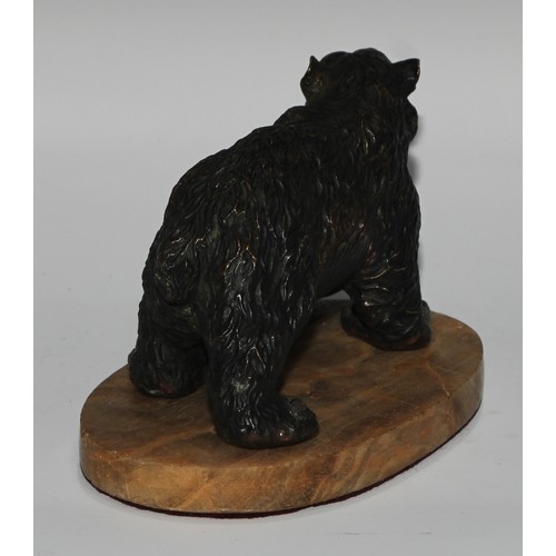 122 - Continental School, a dark patinated bronze, of a bear, oval base, 19cm long