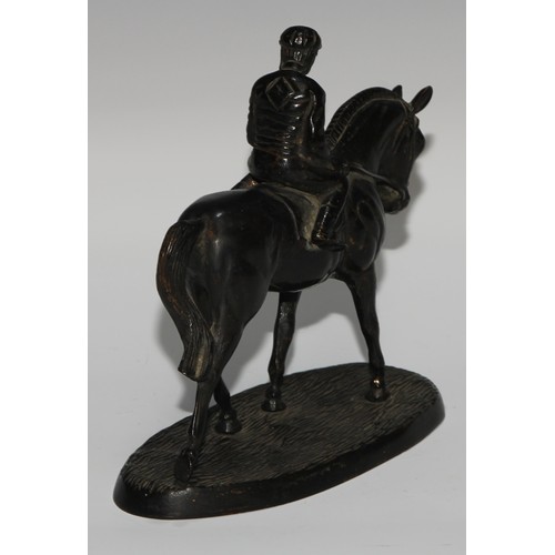 135 - A Continental dark patinated equestrian desk sculpture, cast as a horse and jockey, oval base, 17cm ... 