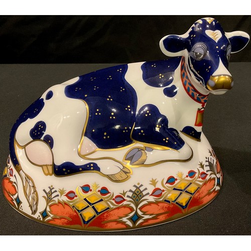 141 - A Royal Crown Derby paperweight, Friesian Cow Buttercup, gold stopper, boxed