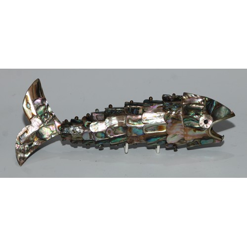 229 - An abalone shell novelty bottle opener, as an articulated fish, 20cm long