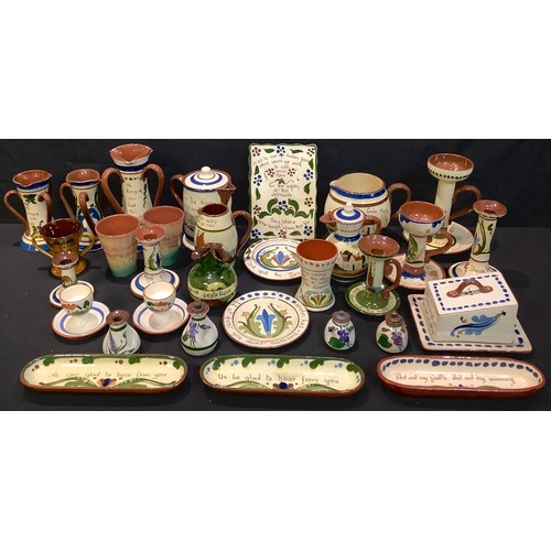 363 - A collection of Devon Torquay mottoware, including plaque, candlesticks, cheese dish, vases, etc, ap... 