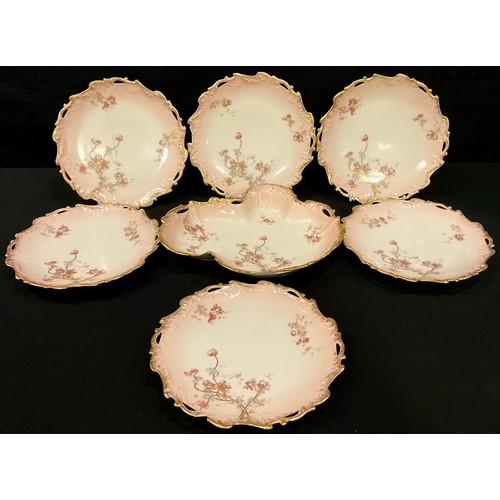 370 - A Limoges part dessert service comprising kidney shaped serving dish and six pierced shaped circular... 