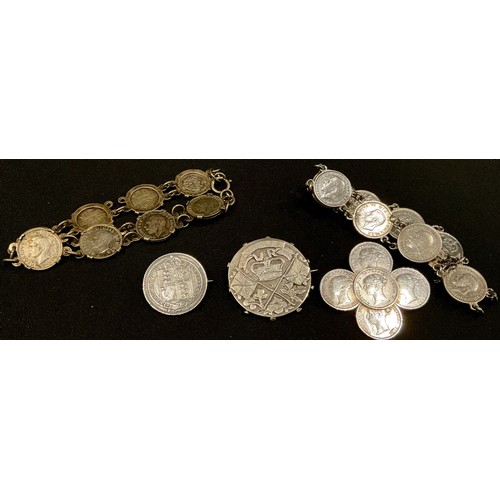 552 - A Victorian silver Jubilee brooch; a Victorian threepenny bit brooch; an 1887 shilling brooch; two s... 