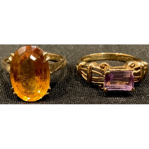 570 - A 9ct gold ring, set with a single faceted oval citrine, ring size Q, 4.47g; a 9ct gold ring set wit... 