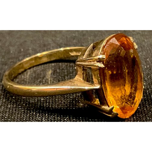 570 - A 9ct gold ring, set with a single faceted oval citrine, ring size Q, 4.47g; a 9ct gold ring set wit... 