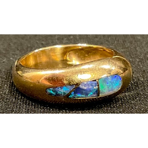 571 - A 14k gold ring, set with an arrangement of three opal specimen stones, size N, unmarked (Purchased ... 