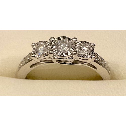 588 - A diamond three stone ring, linear set with three diamonds, 9ct white gold shank, size N, 2.8g gross