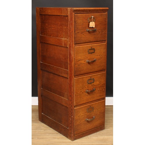 5 - An oak four-drawer filing cabinet, 132cm high, 45cm wide, 68cm deep