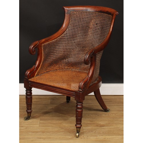 13 - A George/William IV mahogany bergère library chair, in the manner of Gillows of Lancaster and London... 