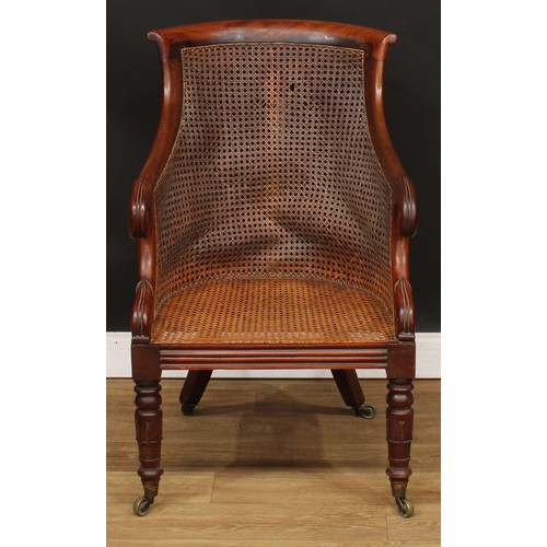 13 - A George/William IV mahogany bergère library chair, in the manner of Gillows of Lancaster and London... 