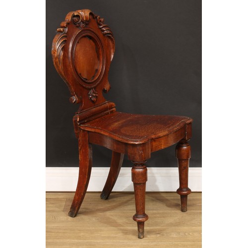 15 - A set of four Victorian oak hall chairs, 89cm high, 47cm wide, the seat 36cm deep (4)