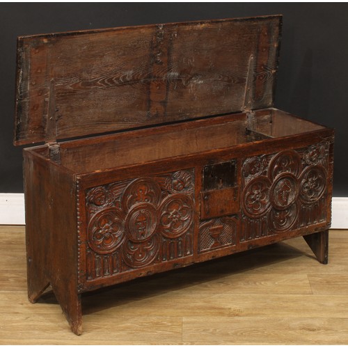 16 - A 17th century and later oak six-plank chest, hinged rectangular top with notched ends above a panel... 