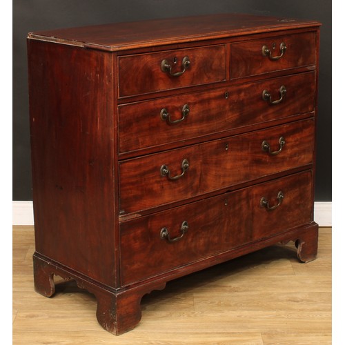 104 - A George III mahogany chest, of two short over three long graduated drawers, skirted base, bracket f... 