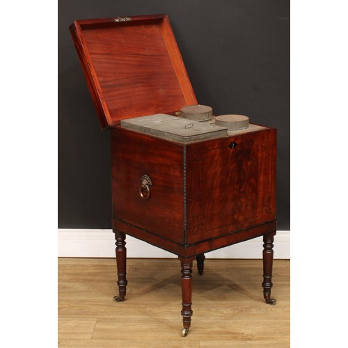 105 - A Regency mahogany teapoy, of cellarette form, hinged cover enclosing a zinc tea caddy, another and ... 