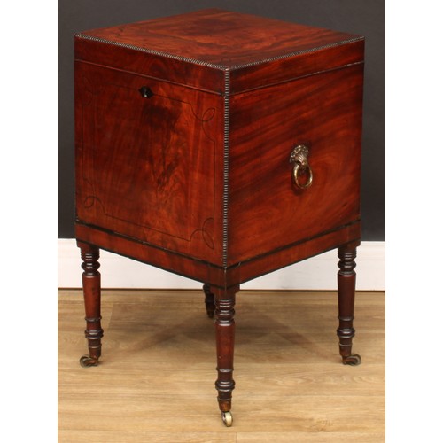 105 - A Regency mahogany teapoy, of cellarette form, hinged cover enclosing a zinc tea caddy, another and ... 