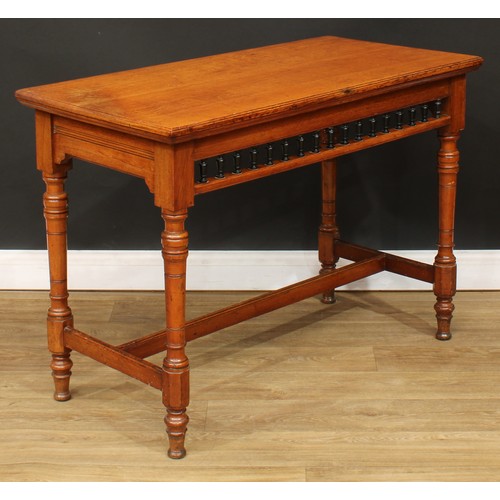 107 - A late Victorian oak primary centre table, rectangular top with moulded edge above a spindle-galleri... 