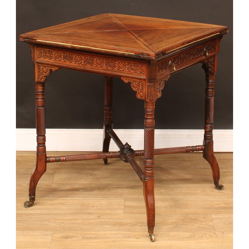 112 - An Edwardian rosewood envelope card table, hinged top above a long frieze drawer, the frieze applied... 