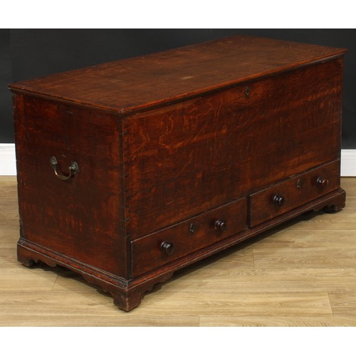 116 - A George III oak mule chest, hinged top enclosing a till, above two short drawers, skirted base, bra... 