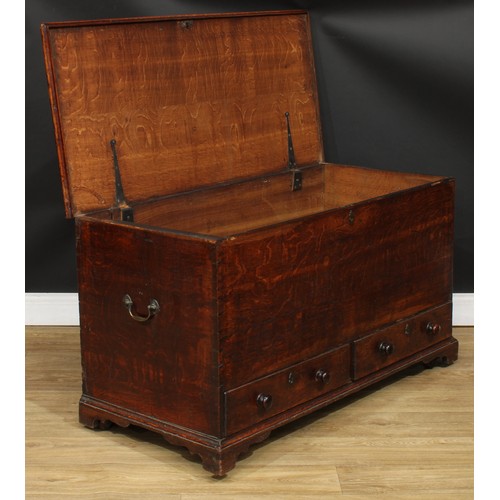 116 - A George III oak mule chest, hinged top enclosing a till, above two short drawers, skirted base, bra... 