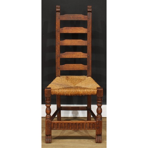 117 - A set of six Rupert Griffiths Monastic Woodcraft oak ladder back dining chairs, comprising four side... 