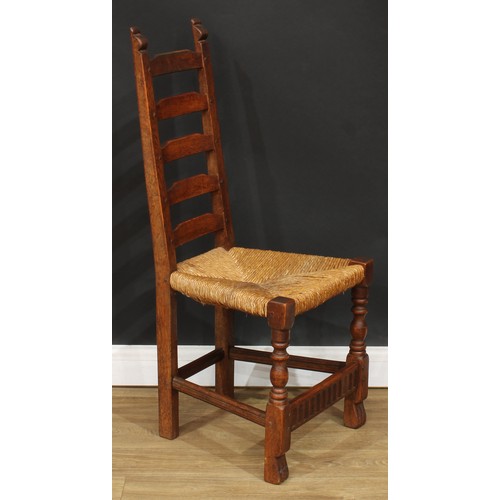 117 - A set of six Rupert Griffiths Monastic Woodcraft oak ladder back dining chairs, comprising four side... 