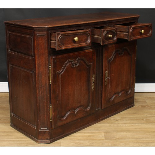 120 - A 19th century French oak enfilade or buffet serving sideboard, slightly oversailing top with canted... 