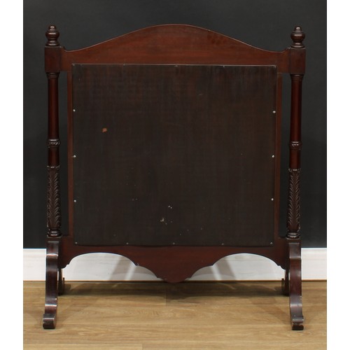 207 - A mahogany fire screen, arched cresting carved in the Art Nouveau taste, woolwork banner, stiff acan... 