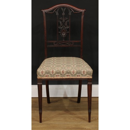 211 - A set of four Edwardian dining chairs, each architectural-form splat carved with leaves and scrolls,... 