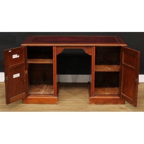 216 - A late Victorian walnut desk, rectangular top with inset tooled and gilt writing surface above a pai... 