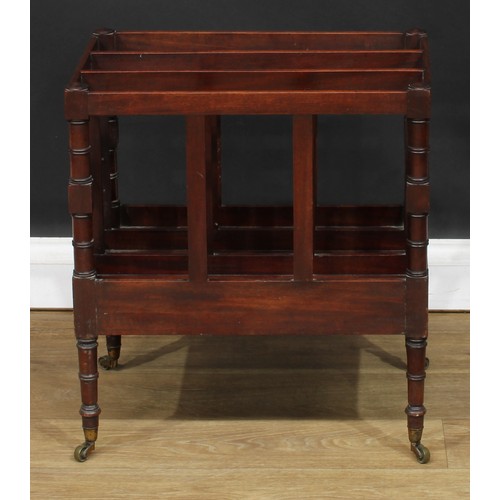 217 - A George III mahogany three-section Canterbury, ring-turned supports and legs, brass casters, 54cm h... 